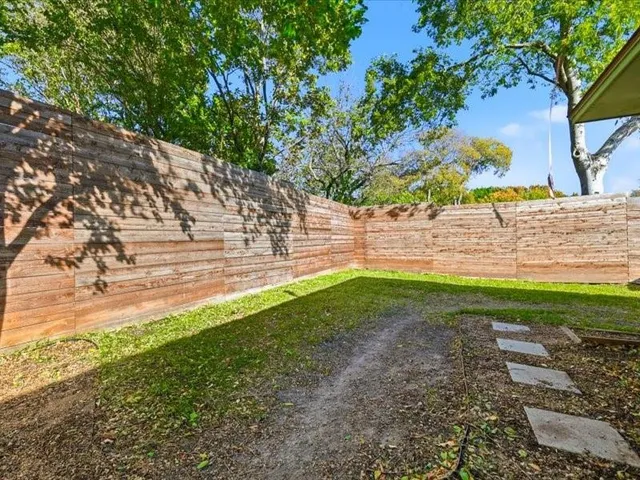 a view of a backyard with a house