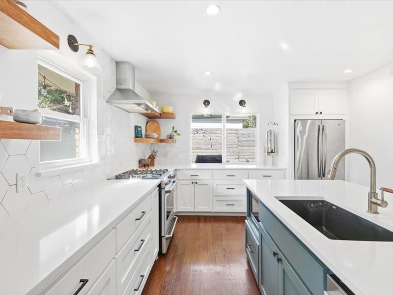 2330 Peavy Place Dallas, TX 75228 - Photo 5 of 39 a kitchen with white cabinets appliances and a window