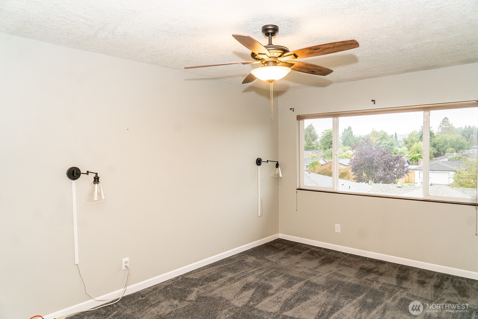 2005 Tibbetts Drive, Unit 305 Longview, WA 98632 - Photo 11 of 16 a view of a room with a ceiling fan and window