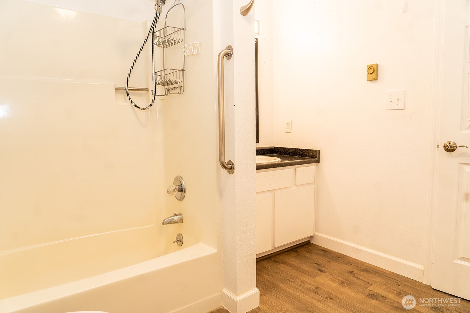 2005 Tibbetts Drive, Unit 305 Longview, WA 98632 - Photo 15 of 16 a bathroom with a bathtub and a shower
