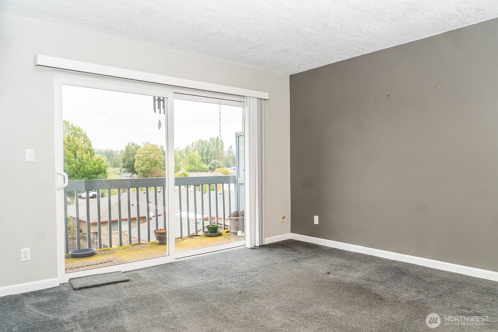 2005 Tibbetts Drive, Unit 305 Longview, WA 98632 - Photo 8 of 16 a view of an empty room with a balcony