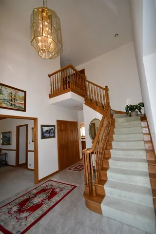 a balcony with table and chairs
