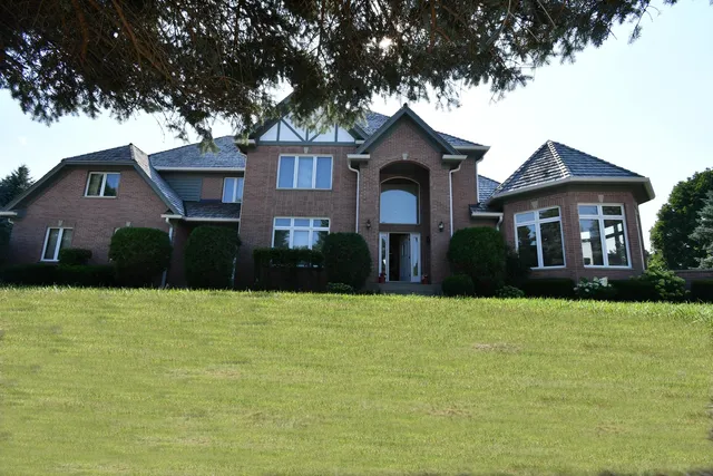 a front view of a house with a yard