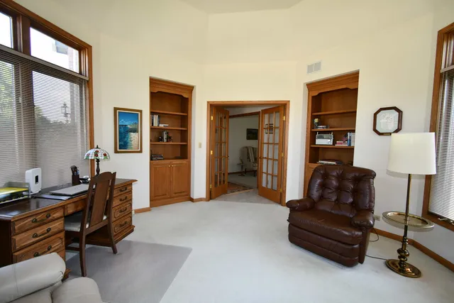 a bedroom with bed and window