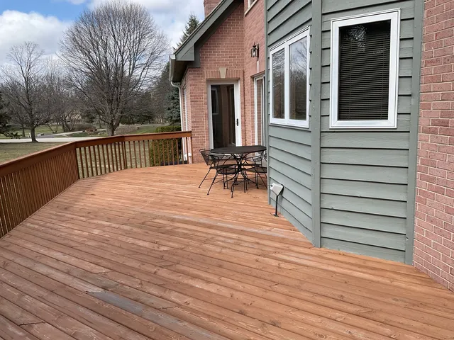 a balcony with view of outdoor space