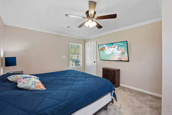 a bed room with a bed and a chandelier