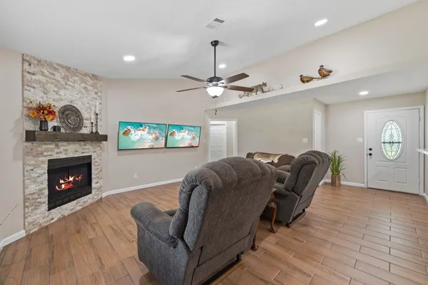 a living room with furniture and a fireplace