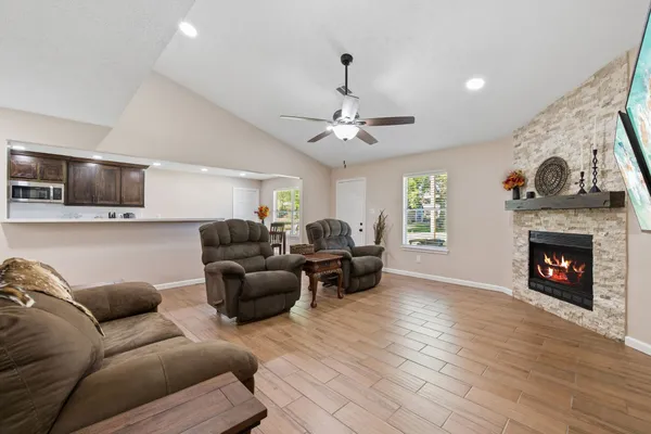 a living room with furniture and a fireplace