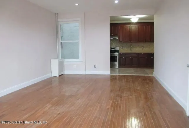 a view of kitchen and wooden floor