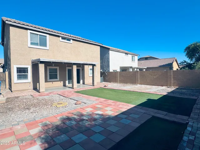 a view of a pathway with a house in the background