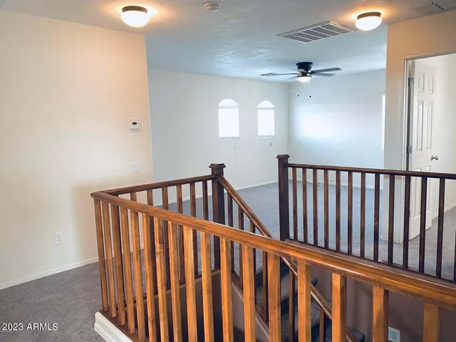 a view of staircase with railing windows and stairs