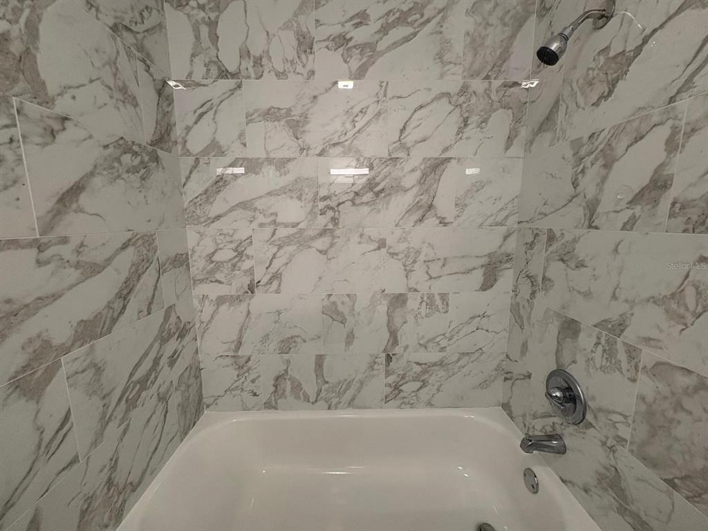 4033 Henley Road, Unit 1707 Orlando, FL 32839 - Photo 39 of 66 a bathroom with a bathtub