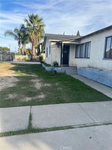 a front view of house with yard and outdoor seating