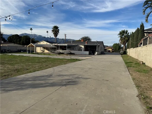 a view of a swimming pool with an outdoor seating