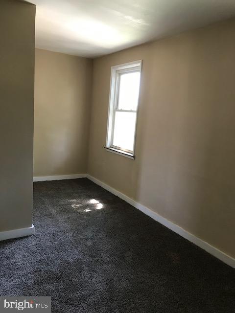 2 Yorkway Dundalk, MD 21222 - Photo 7 of 8 an empty room with a empty space and windows