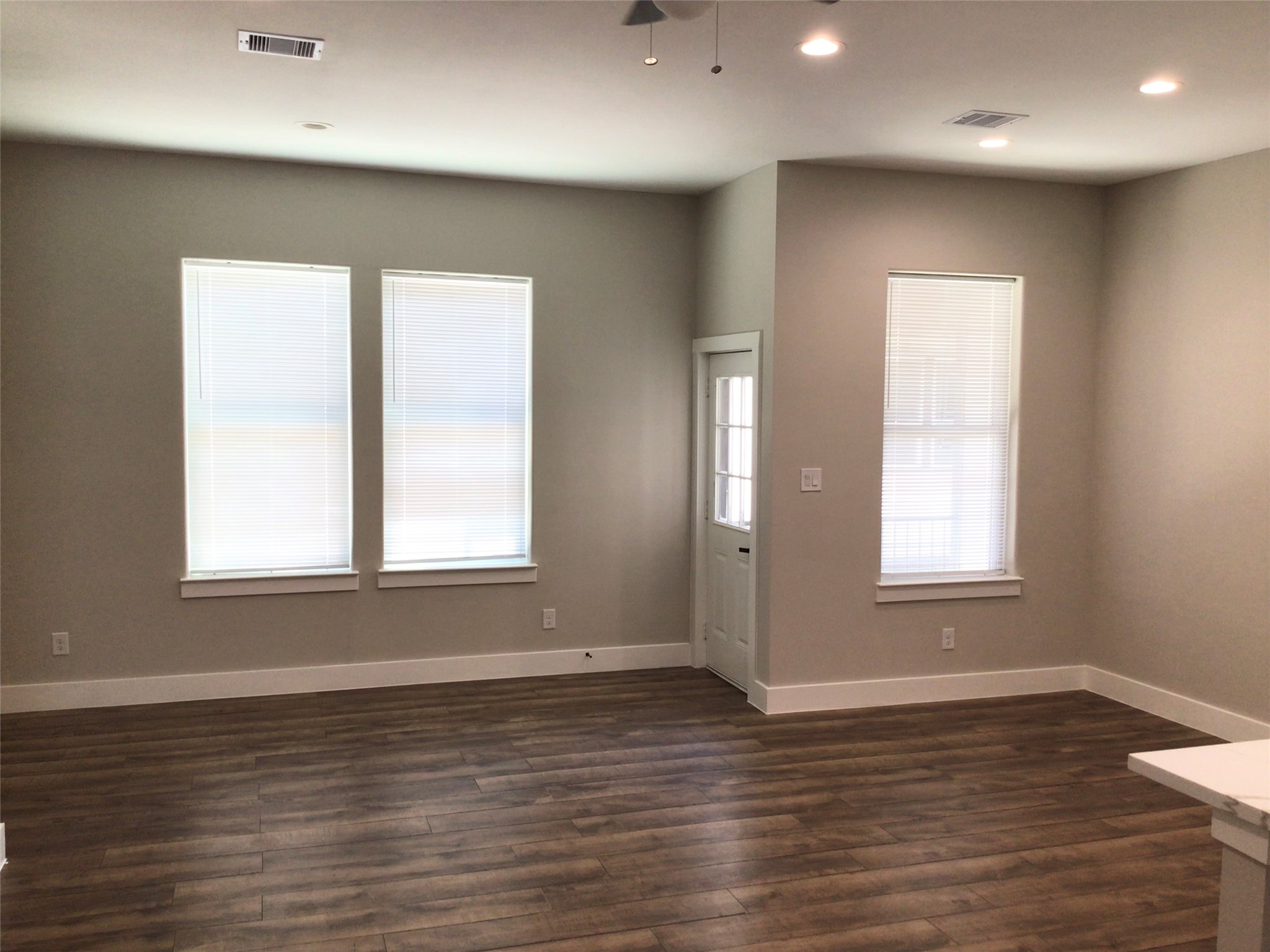 2109 Marnel Road, Unit G Houston, TX 77055 - Photo 11 of 27 an empty room with wooden floor and windows