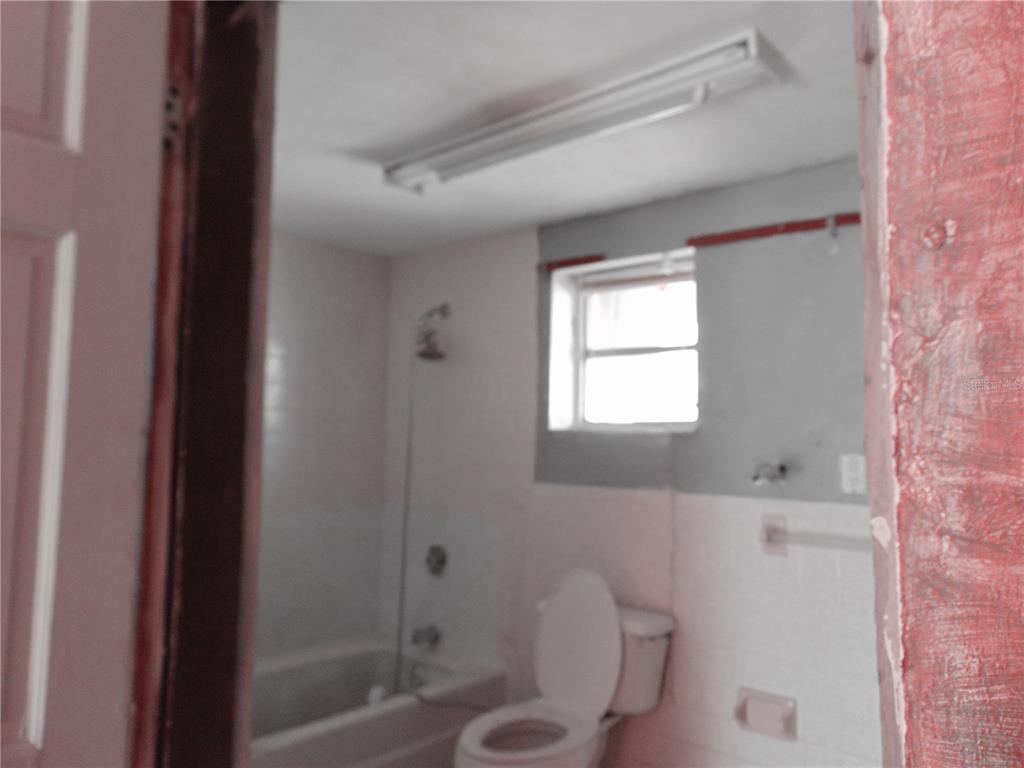 4385 Guard Street Punta Gorda, FL 33980 - Photo 12 of 14 a bathroom with a toilet and a shower