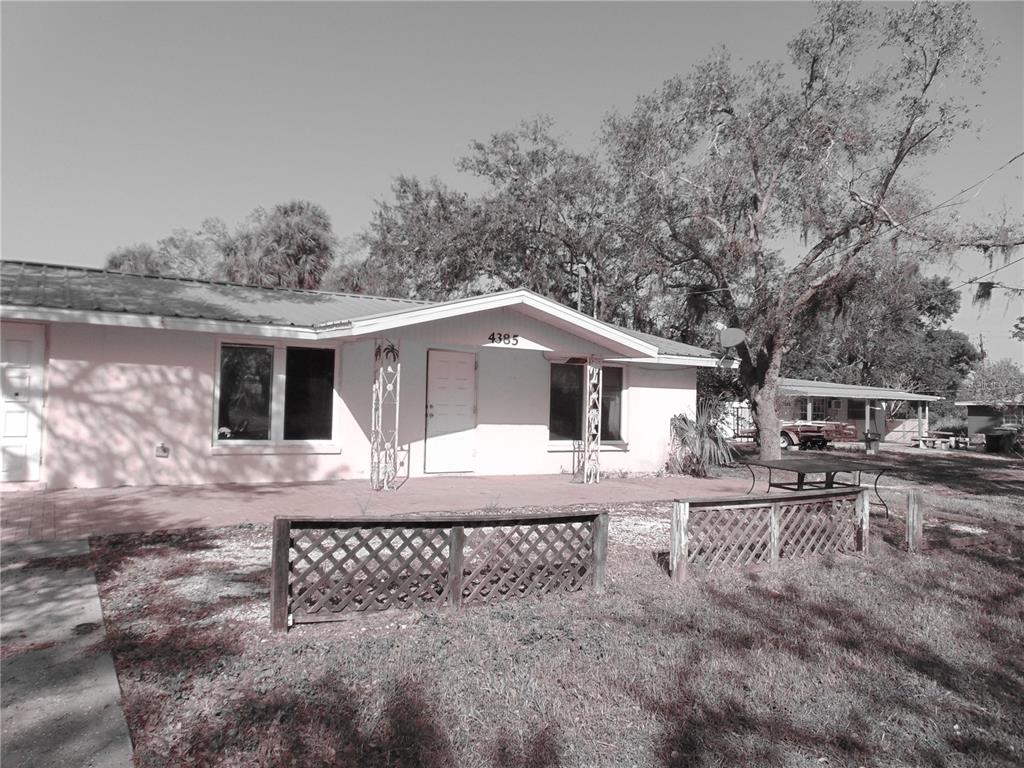 4385 Guard Street Punta Gorda, FL 33980 - Photo 2 of 14 a view of a yard in front of a house
