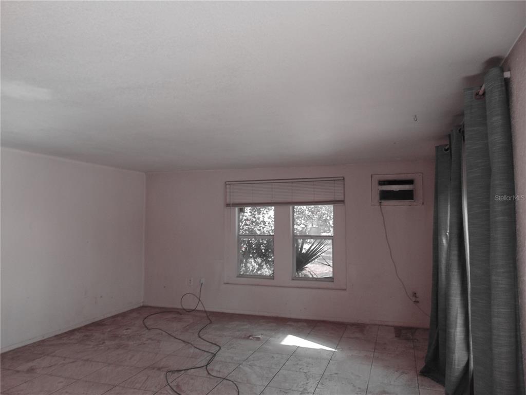 4385 Guard Street Punta Gorda, FL 33980 - Photo 4 of 14 an empty room with windows