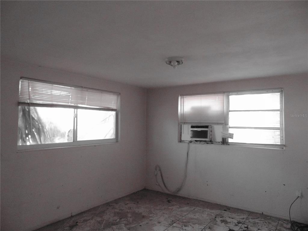 4385 Guard Street Punta Gorda, FL 33980 - Photo 6 of 14 an empty room with windows