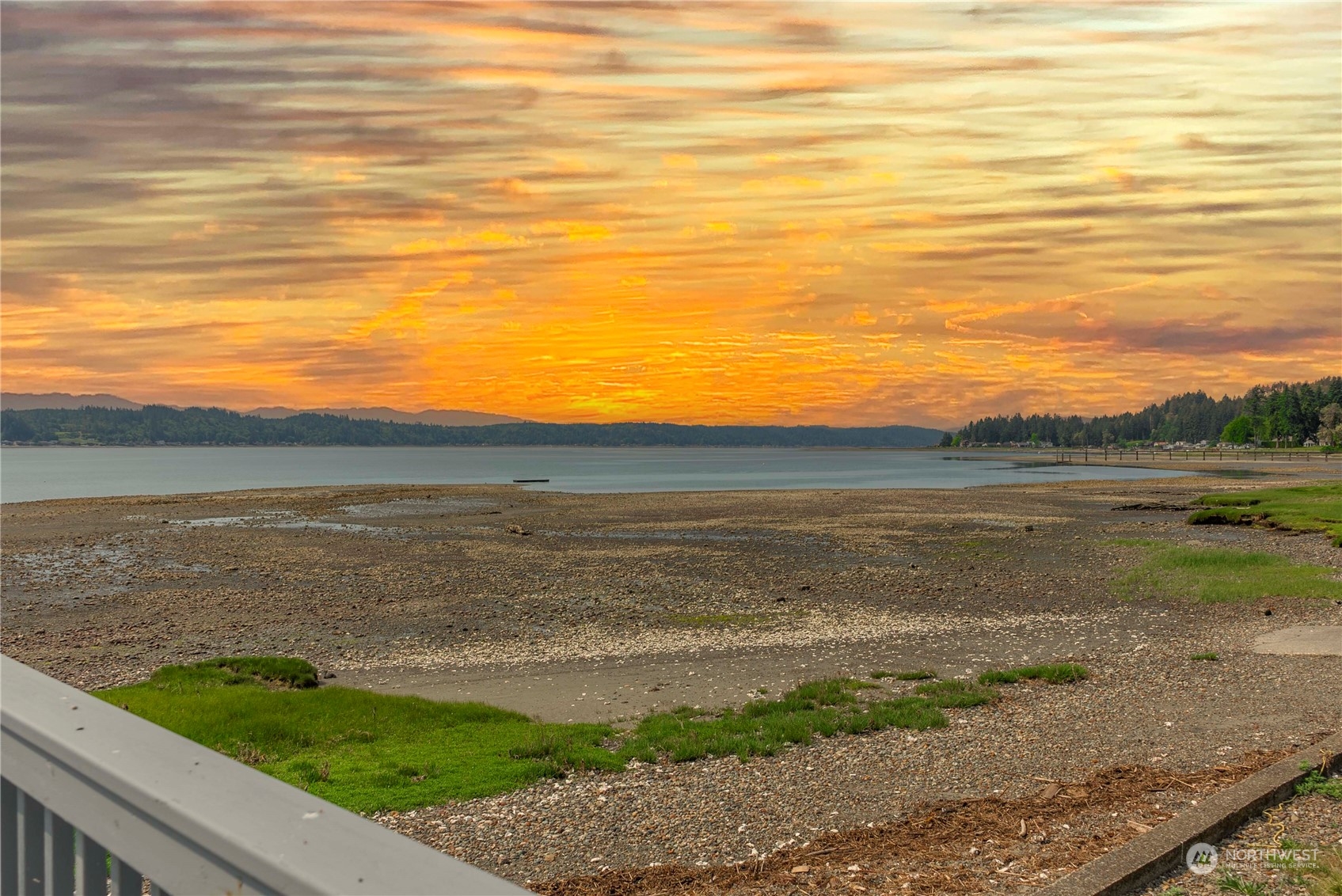 191 Northeast Wagon Wheel Road Belfair, WA 98528 - Photo 1 of 27 a view of an ocean from a balcony