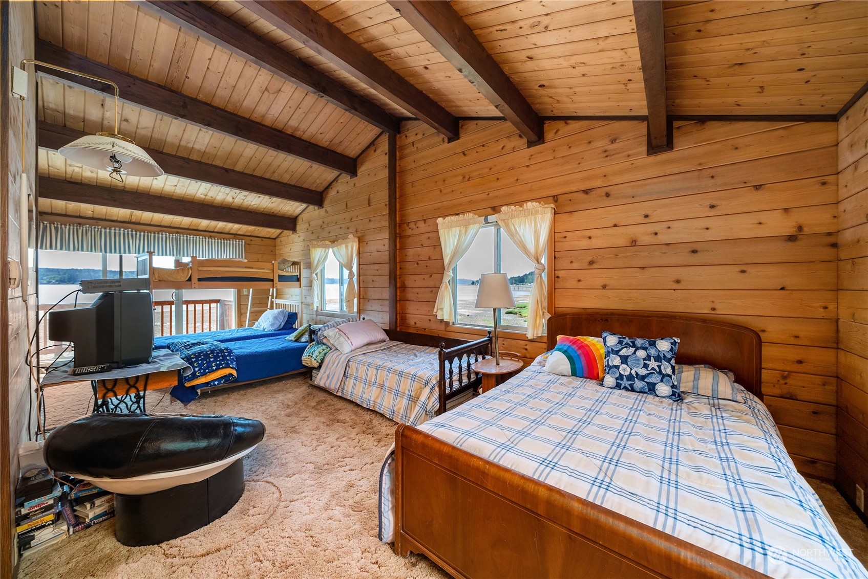 191 Northeast Wagon Wheel Road Belfair, WA 98528 - Photo 16 of 27 a bedroom with furniture and a wooden floor