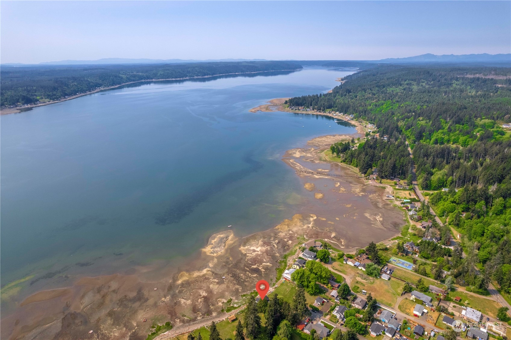 191 Northeast Wagon Wheel Road Belfair, WA 98528 - Photo 3 of 27 a view of a lake with a mountain