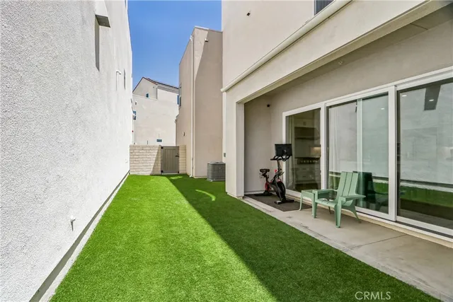 a view of backyard with sitting area