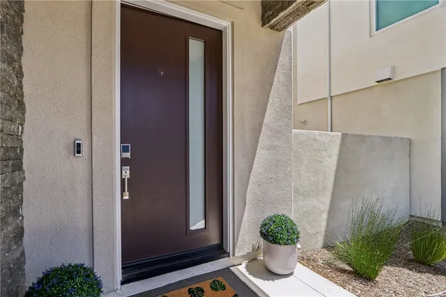 a house with potted plant in front of it