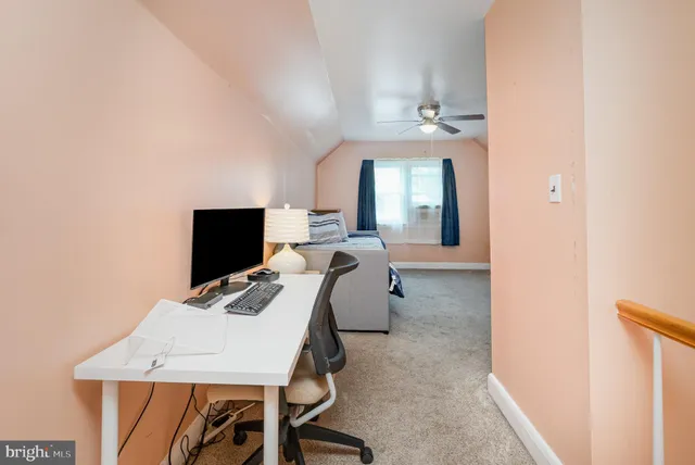 a workspace with furniture and window