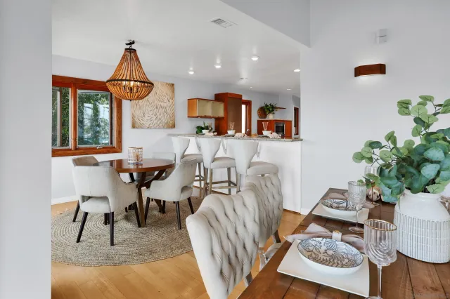 a large white kitchen with a sink and dishwasher a refrigerator with a granite countertops