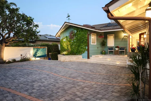 a living room with fireplace furniture and a flat screen tv