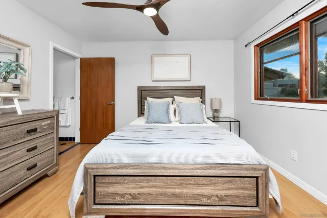 an aerial view of a house with swimming pool and outdoor seating