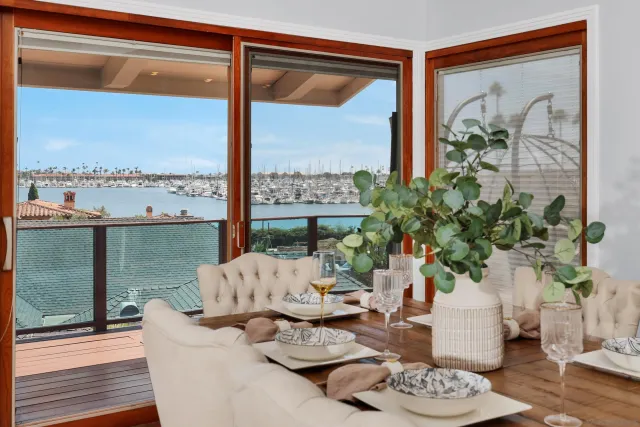 a view of a house with swimming pool and sitting area