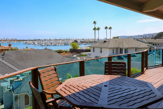 a living room with furniture a rug and a table