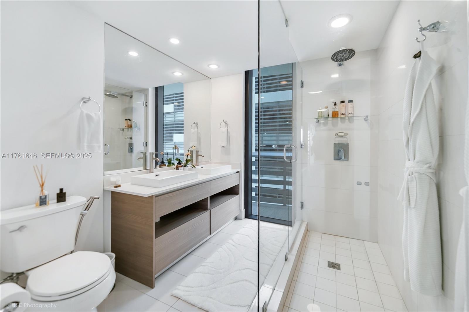 Edgewater Miami, FL 33137 - Photo 11 of 15 a bathroom with a sink a toilet and shower