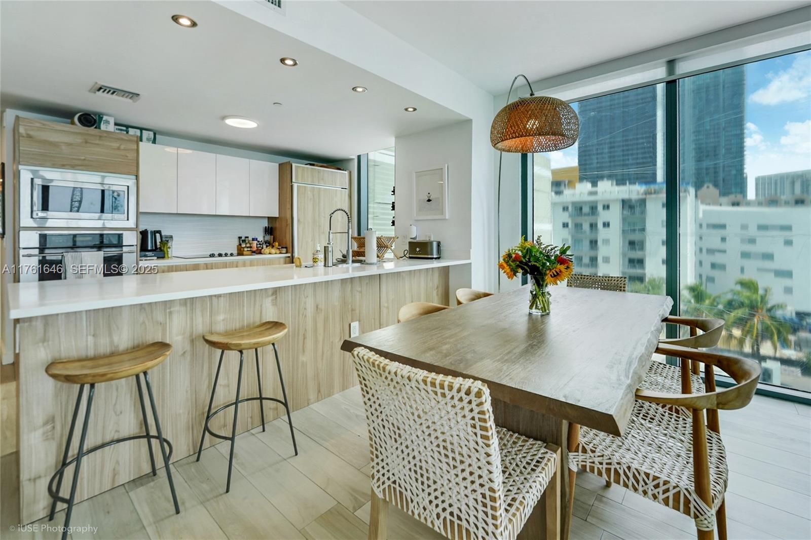 Edgewater Miami, FL 33137 - Photo 4 of 15 a dining table with chairs and window