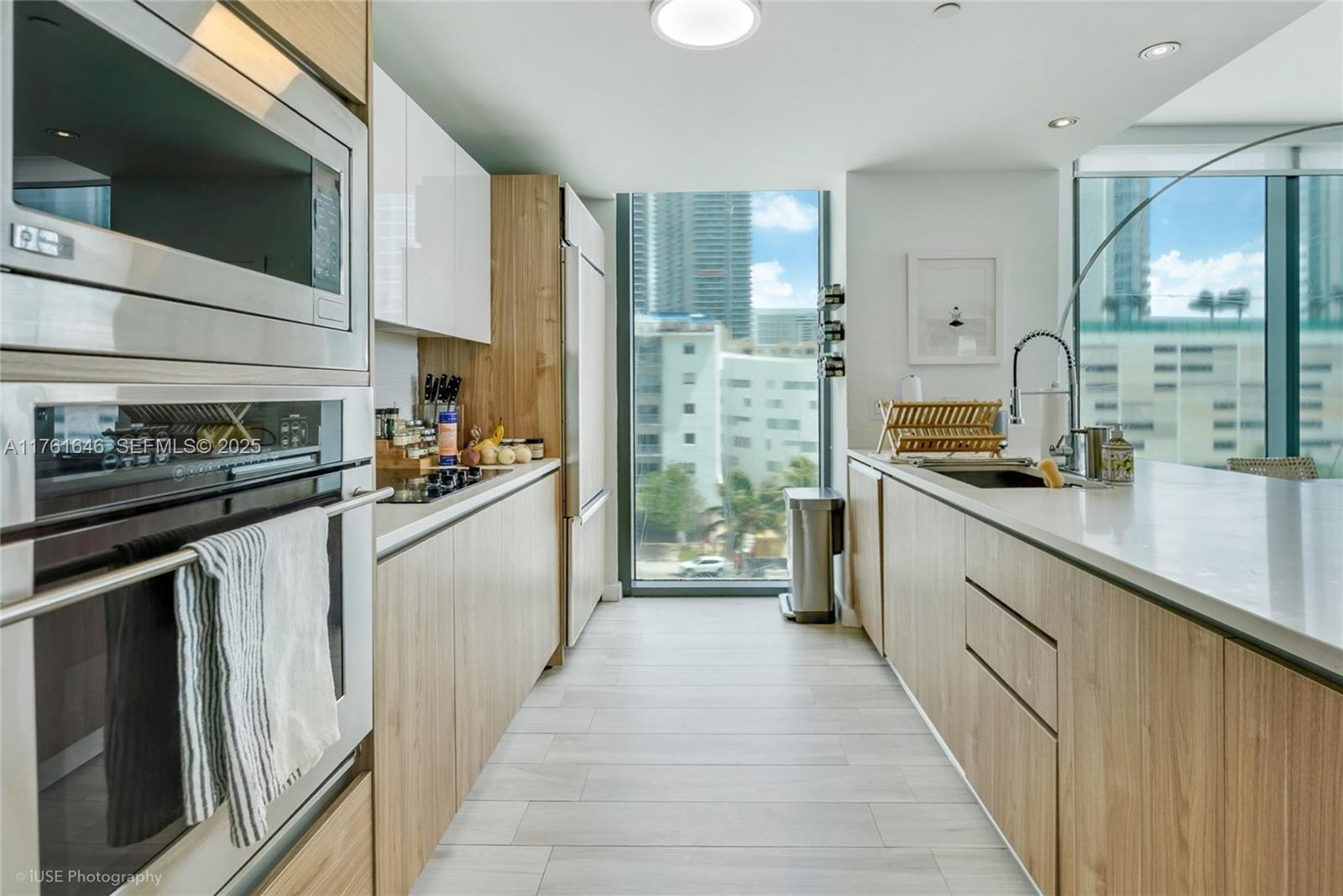 Edgewater Miami, FL 33137 - Photo 5 of 15 a kitchen with stainless steel appliances kitchen island granite countertop a sink and cabinets