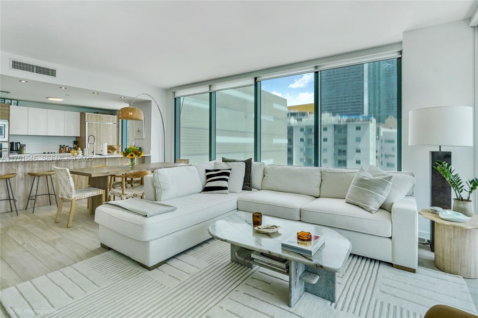 Edgewater Miami, FL 33137 - Photo 6 of 15 a living room with furniture and a large window