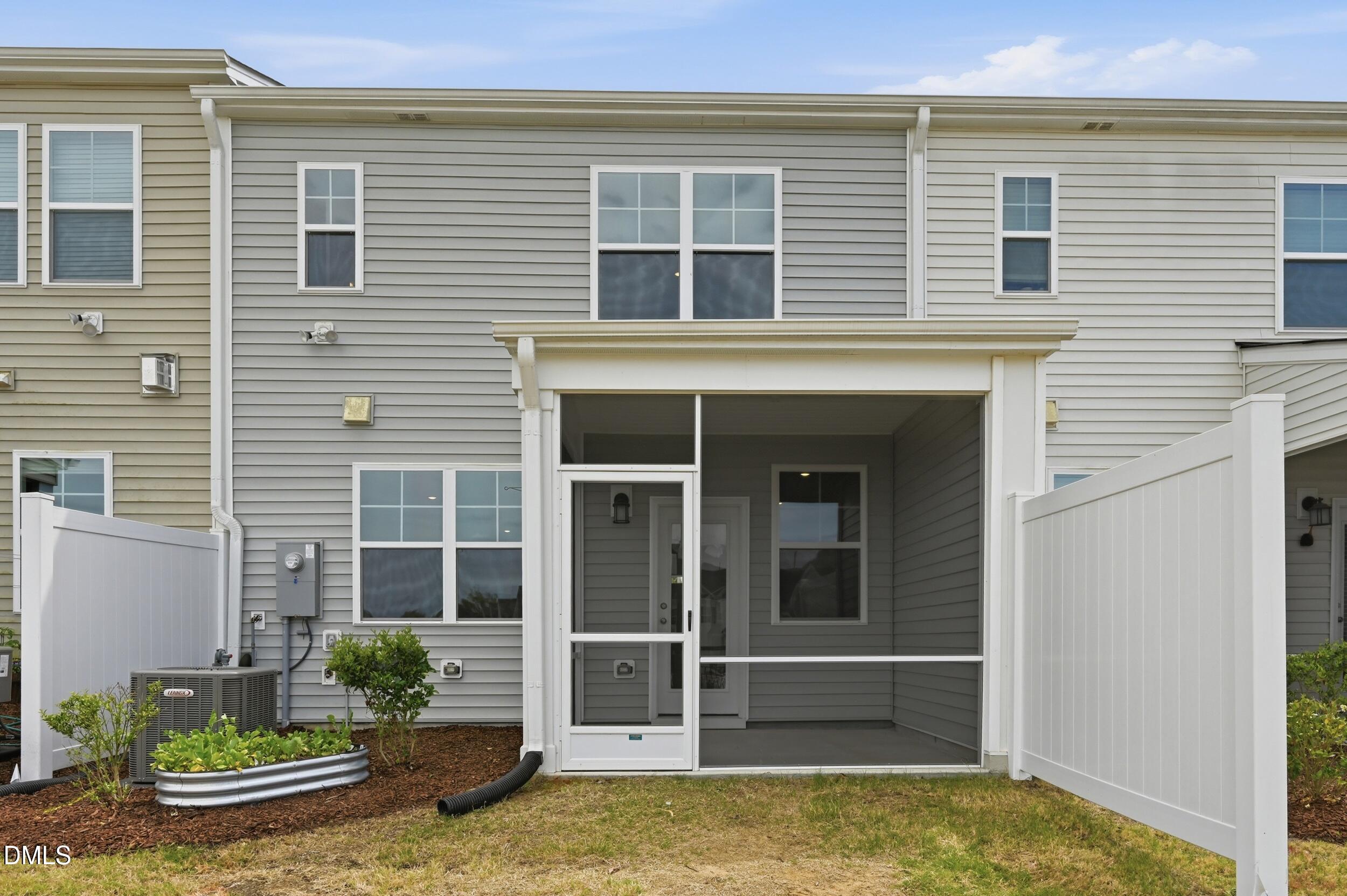 5011 Kota Street Raleigh, NC 27610 - Photo 40 of 42 a view of front door and potted plants