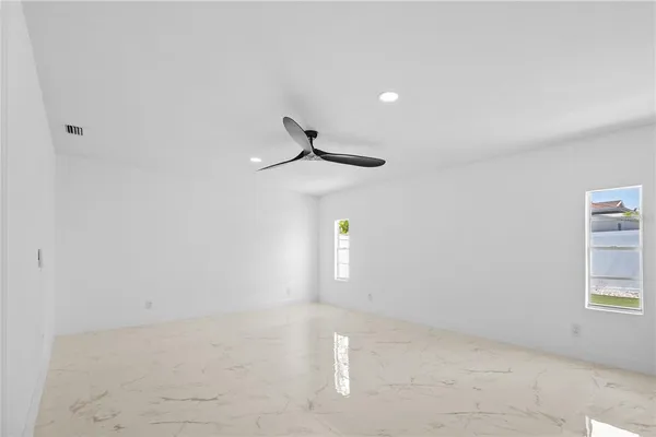 a view of empty room with windows