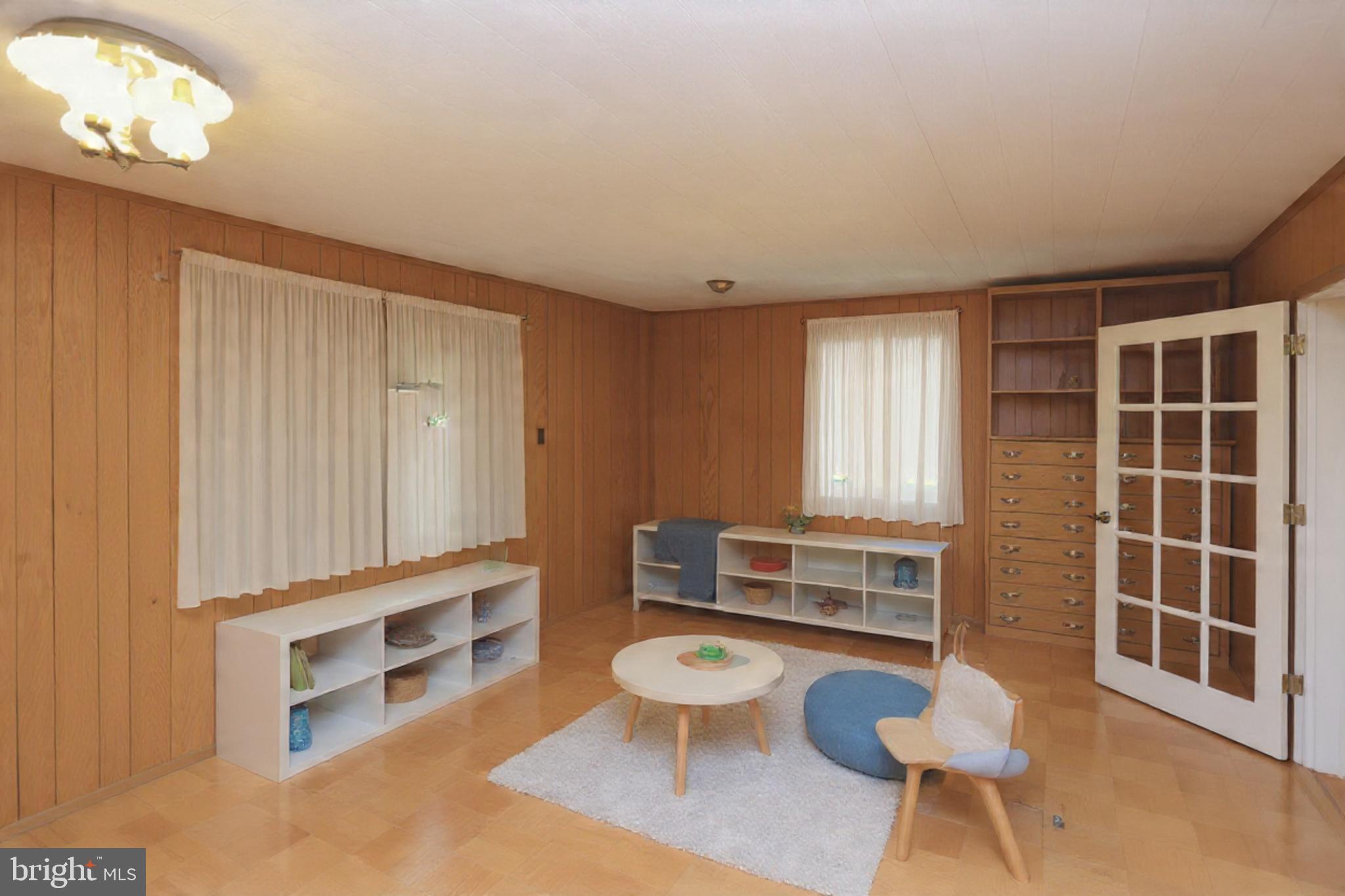 9110 Montpelier Drive Laurel, MD 20708 - Photo 12 of 30 a room with furniture a rug and a window