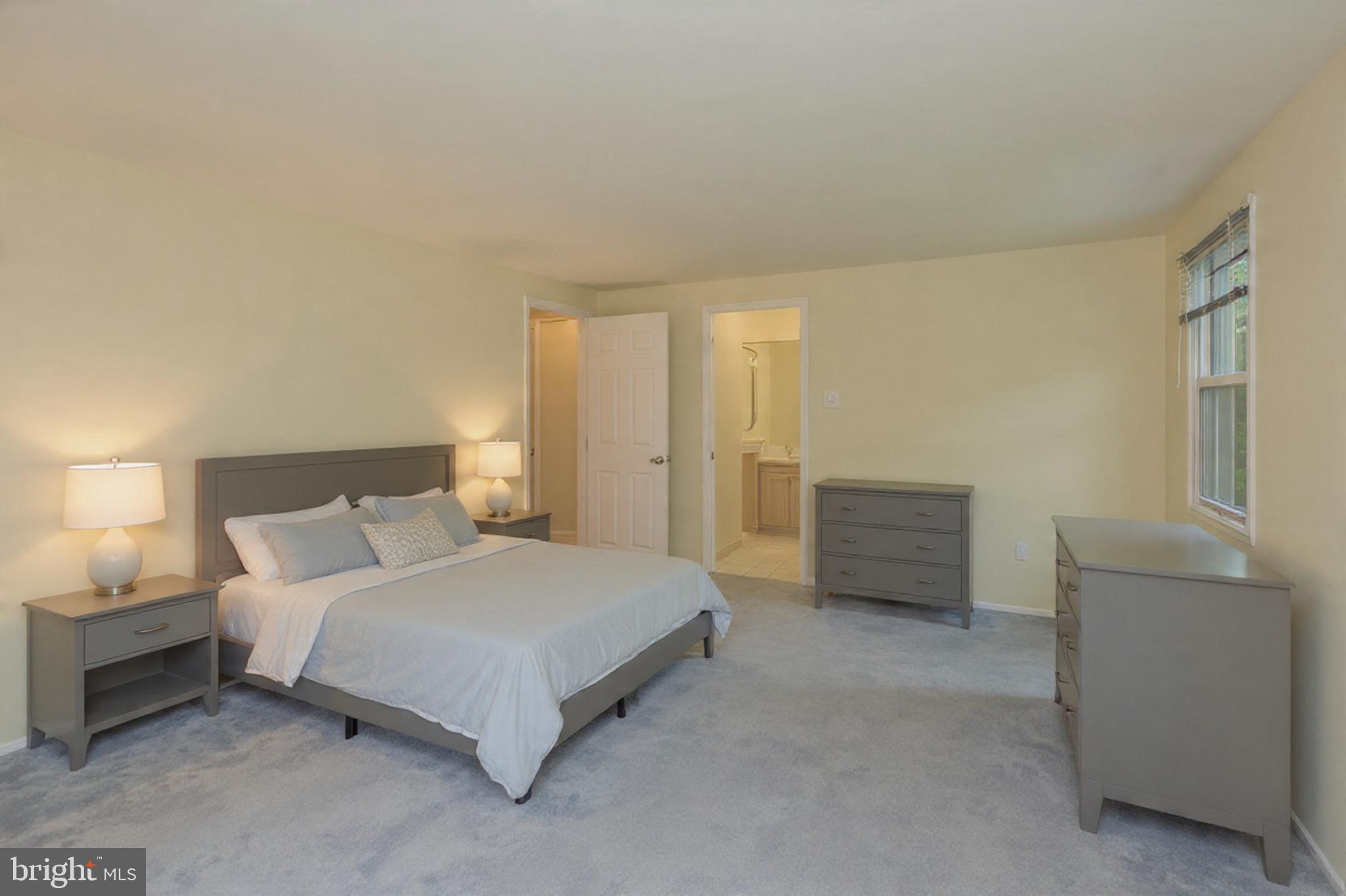 9110 Montpelier Drive Laurel, MD 20708 - Photo 13 of 30 a bedroom with a bed and cabinet