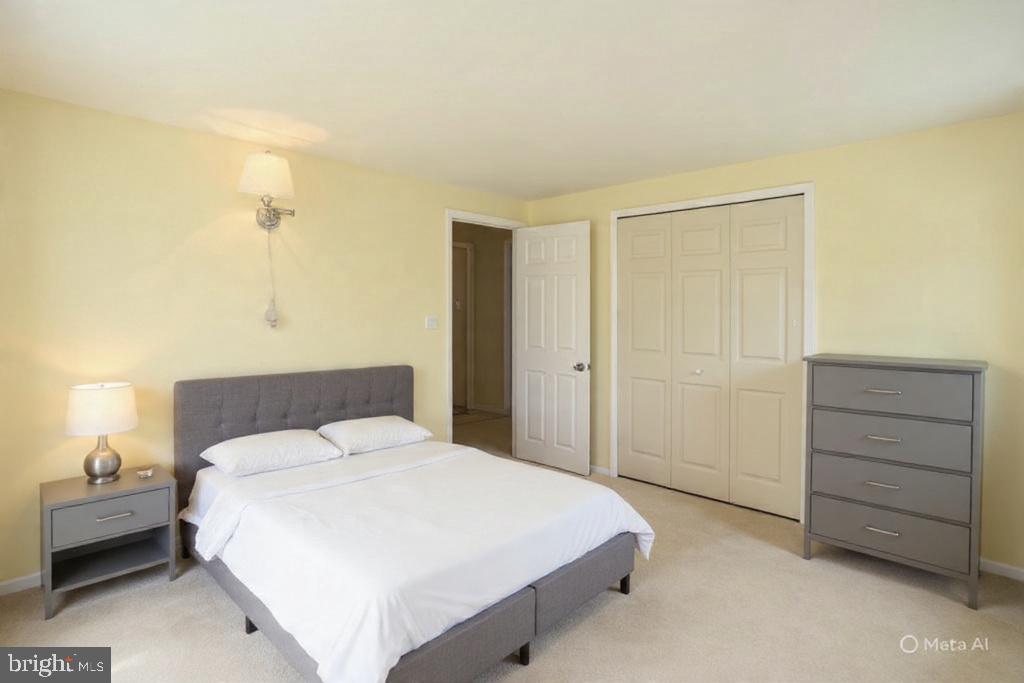9110 Montpelier Drive Laurel, MD 20708 - Photo 18 of 30 a bedroom with a bed and a dresser