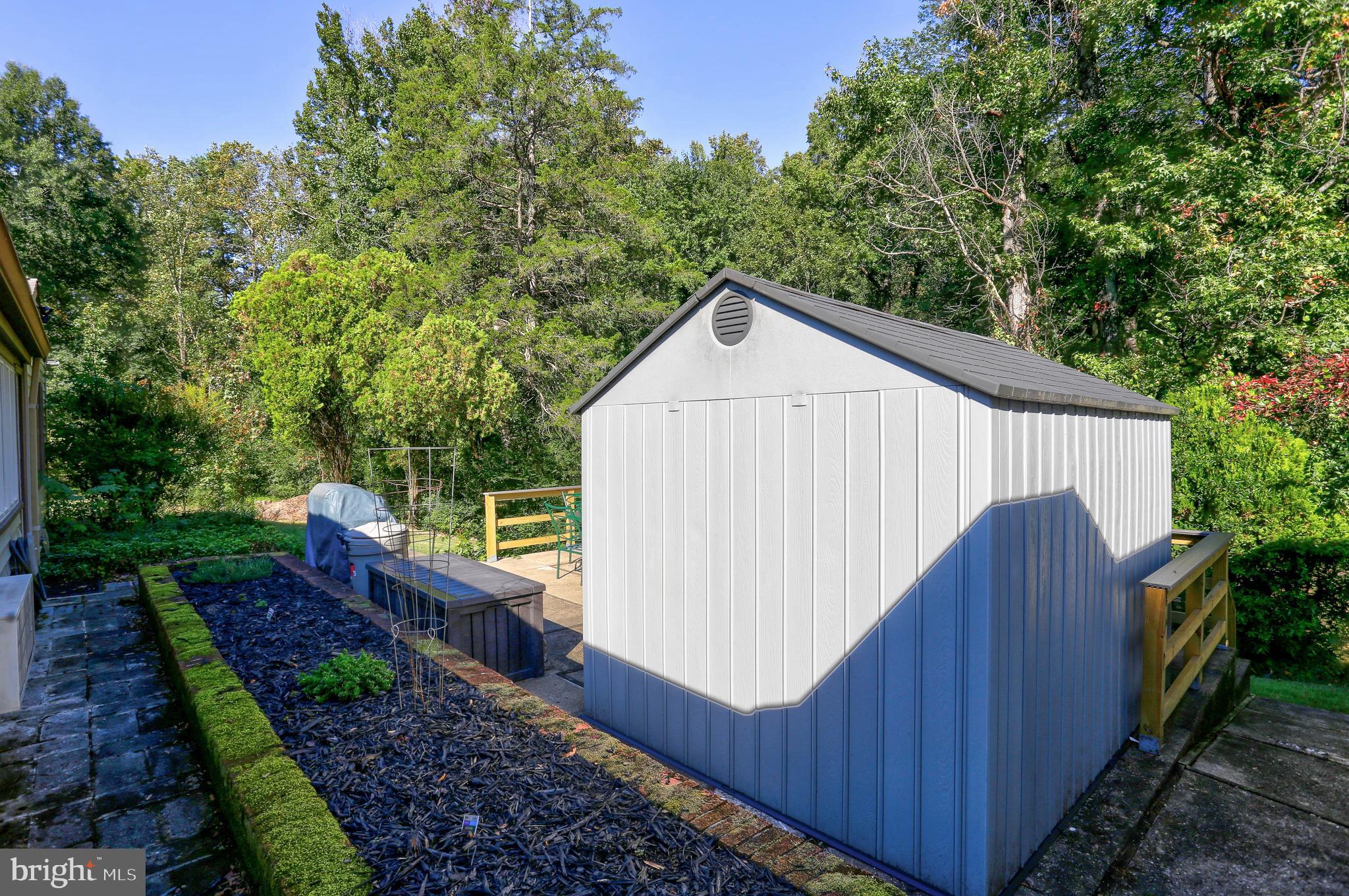 9110 Montpelier Drive Laurel, MD 20708 - Photo 23 of 30 a view of a small house with a small yard and wooden fence