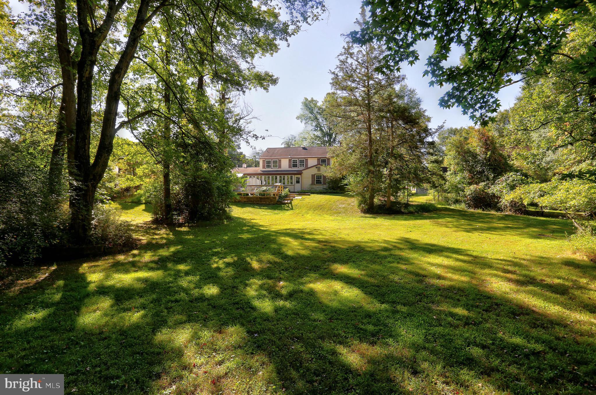 9110 Montpelier Drive Laurel, MD 20708 - Photo 26 of 30 a view of yard with swimming pool and trees