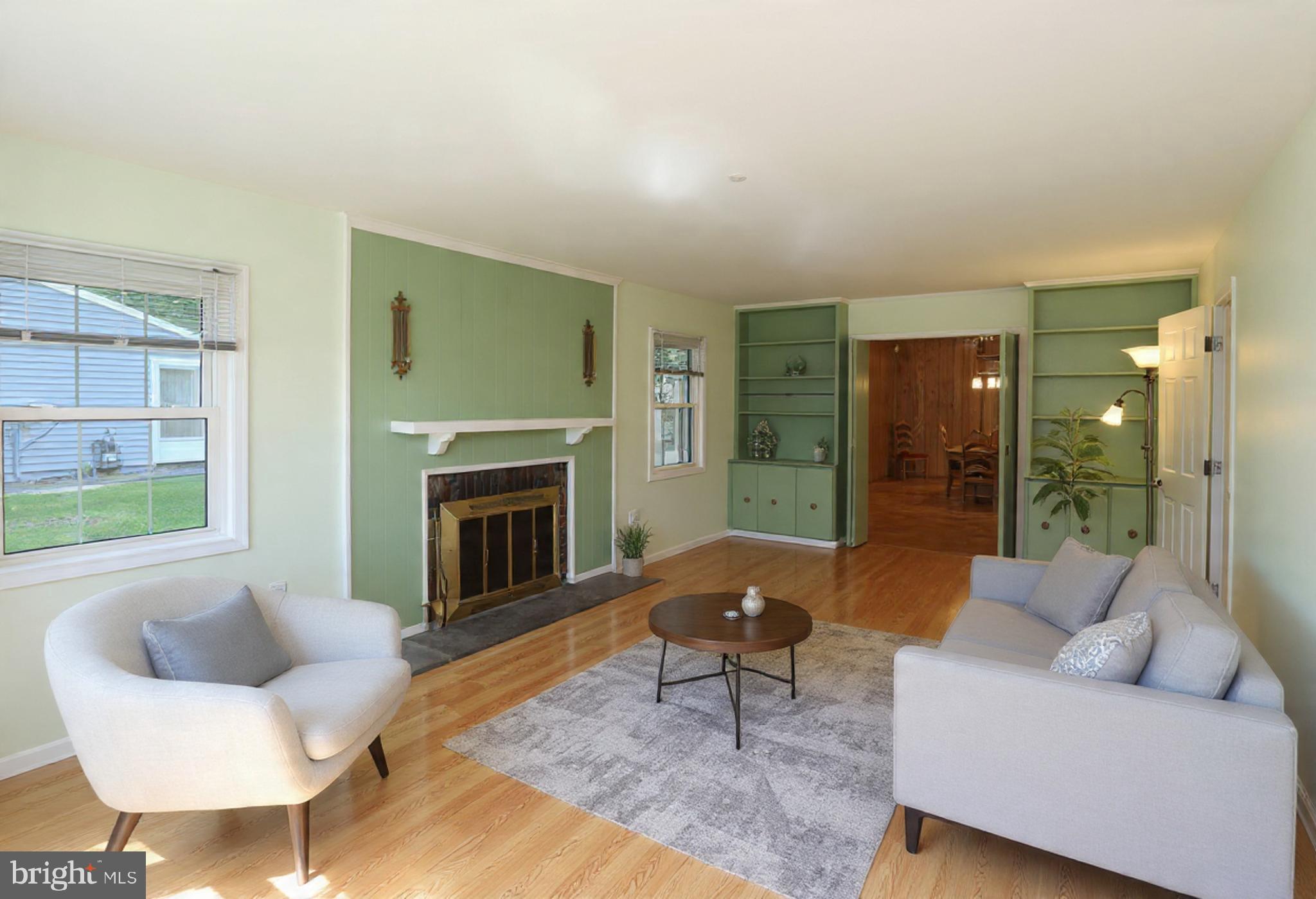 9110 Montpelier Drive Laurel, MD 20708 - Photo 6 of 30 a living room with furniture and a fireplace