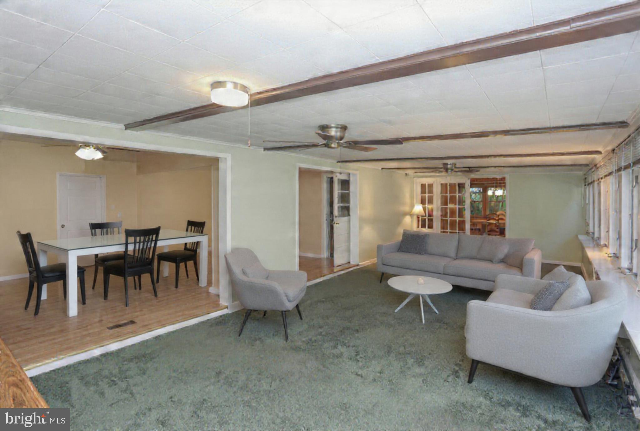 9110 Montpelier Drive Laurel, MD 20708 - Photo 8 of 30 a living room with furniture and a large window