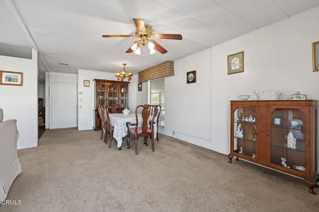 a view of a livingroom with furniture and a chandelier