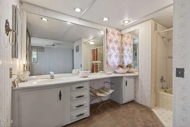 a bathroom with a double vanity sink mirror and double